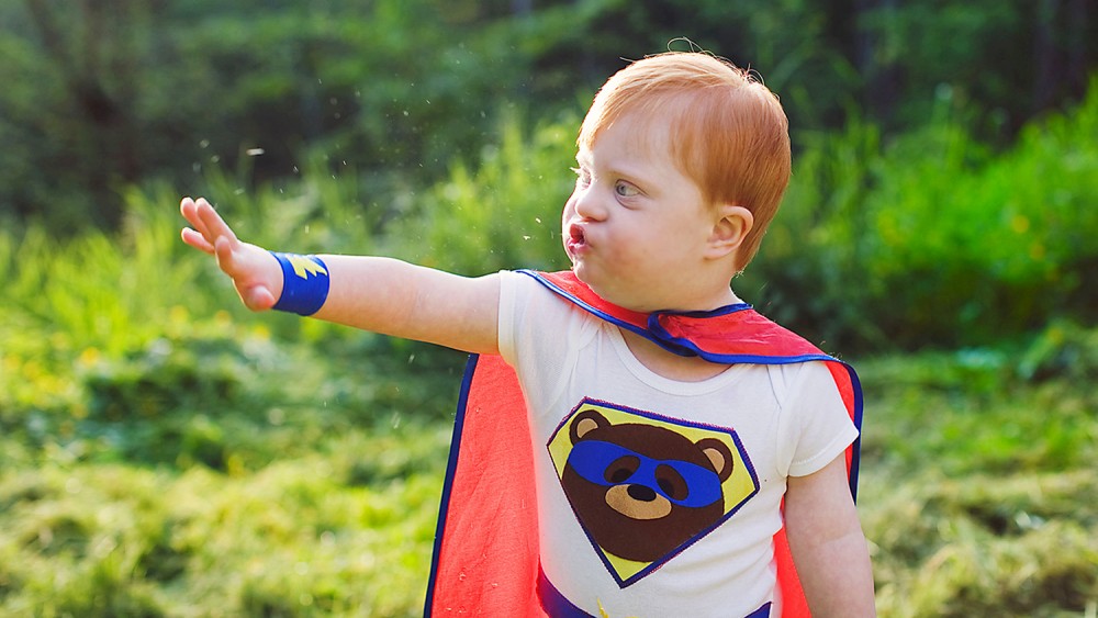 Cody in Renee Bergeron's photo series called "The Superhero Project," which shows kids with special needs dressed as superheroes, showing off their power poses.